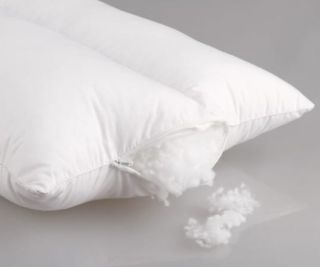A pillow with some of the filling coming out