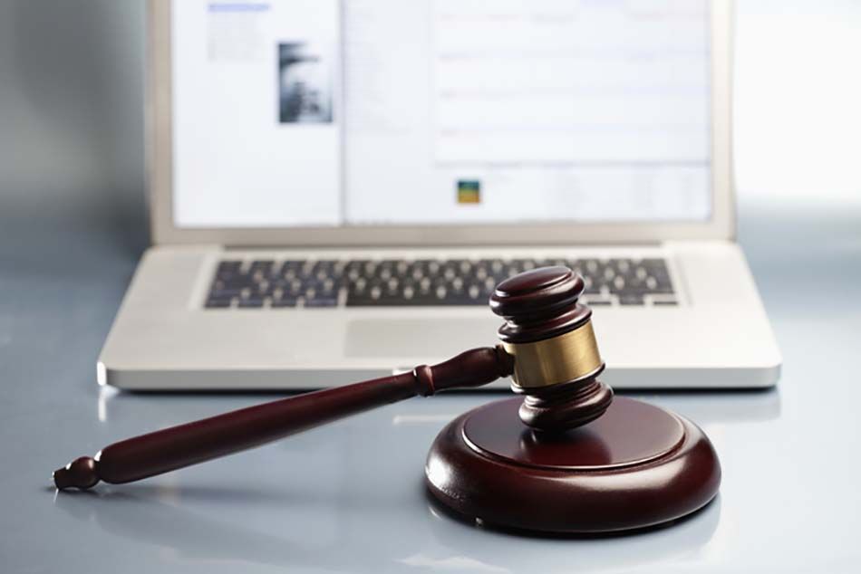 Gavel in front of a computer