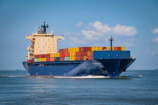 A container ship loaded with shipping containers.