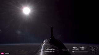 Starship Flight 6 booster in space over the ocean after launch with sun