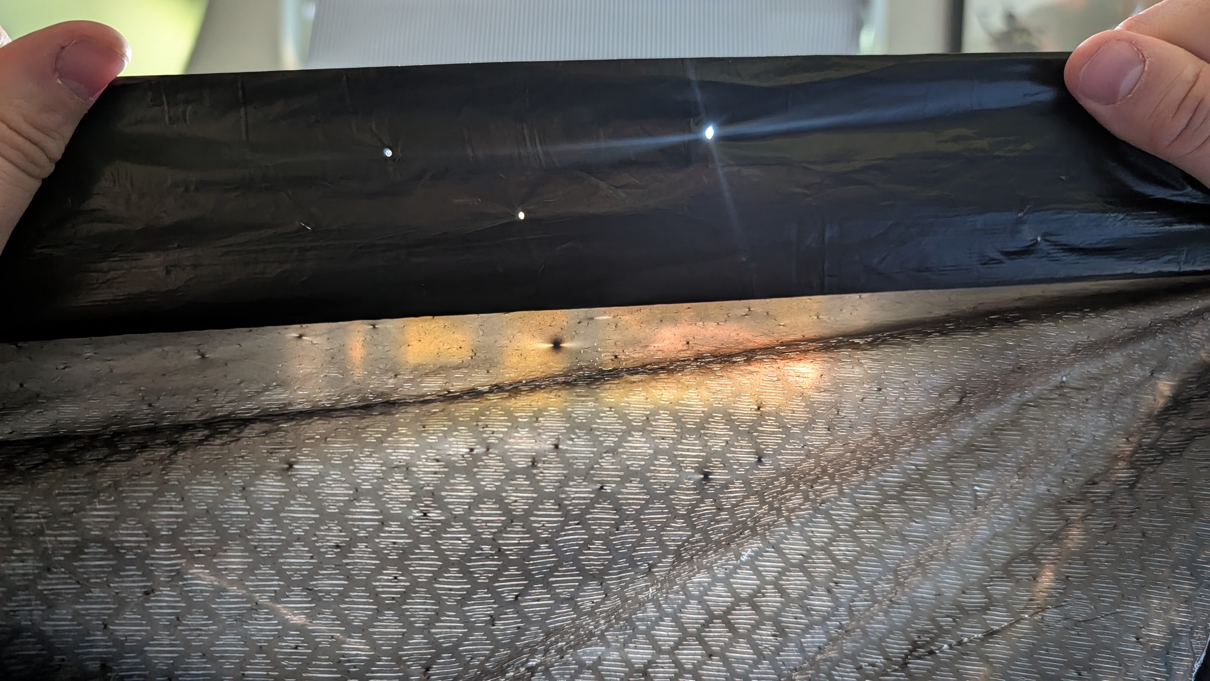 holes burned into a trash bag by samsung galaxy s26 ultra