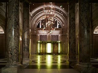 Over at the London Design Festival's main hub, the V&A, lighting brand Bocci has suspended 280 of its 28 series of handblown glass lights from the museum's cupola to create a giant chandelier.