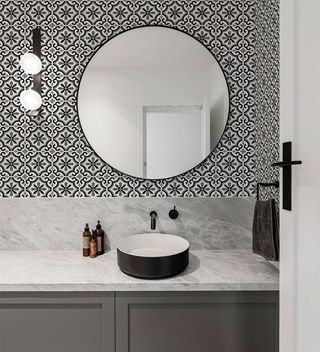 Bathroom with black and white tile effect wallpaper