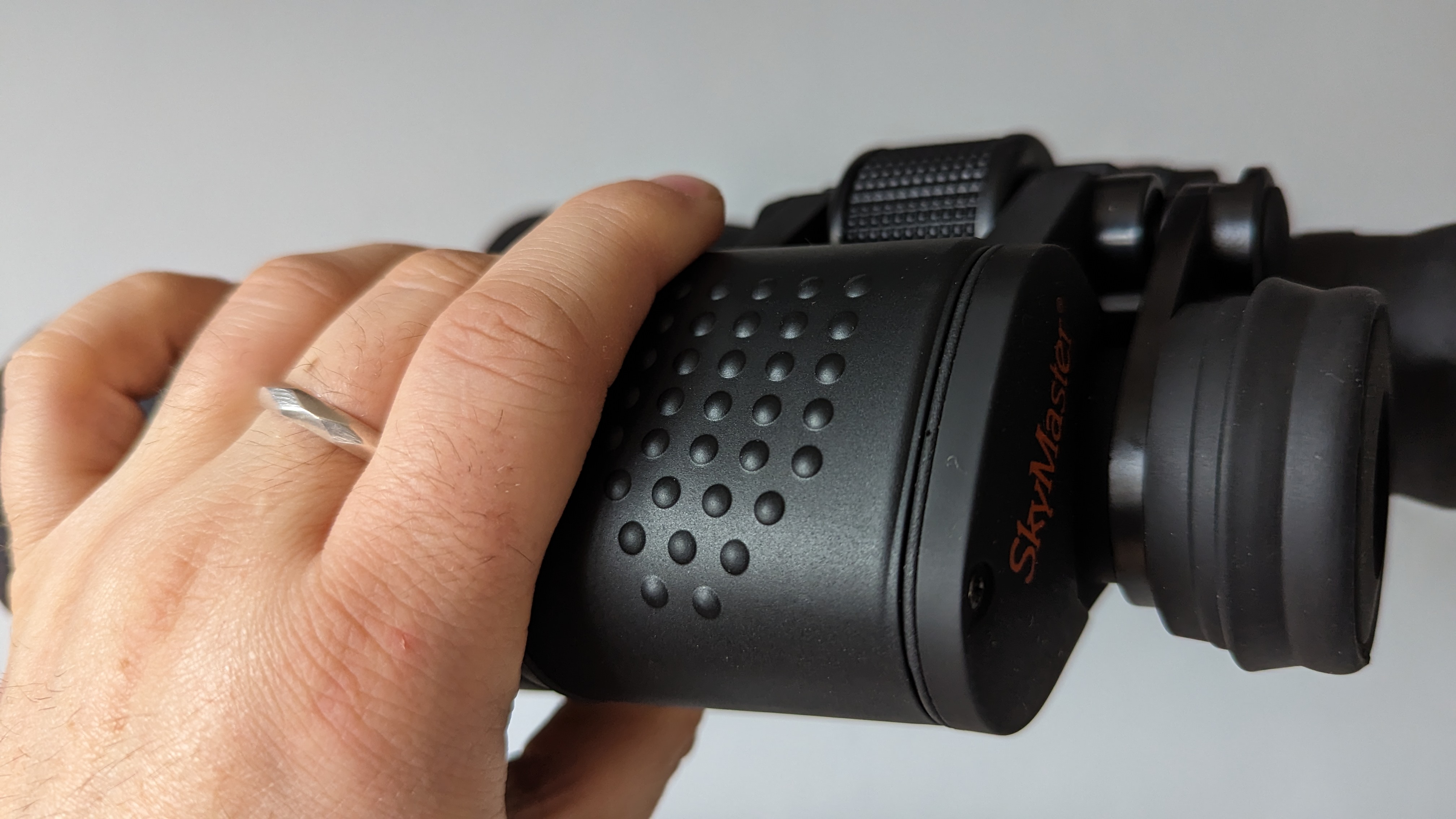 Binoculars in the hands of the author