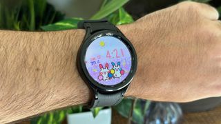 A custom Facer watch face showing two Pokemon cheering for you on the Samsung Galaxy Watch 6 Classic