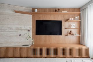 A living room with minimalist shelving