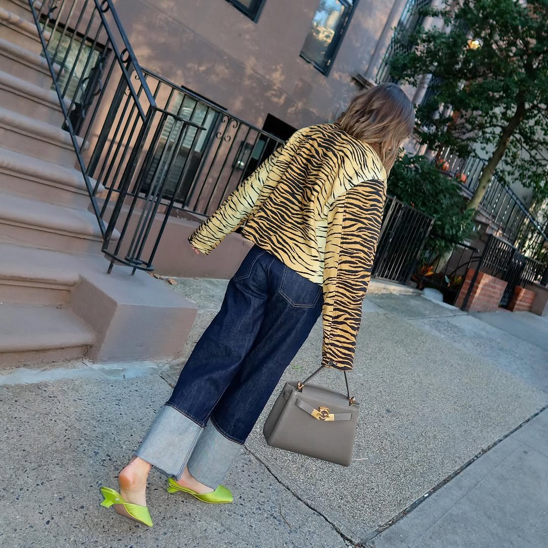 woman wearing holiday denim outfit 2025