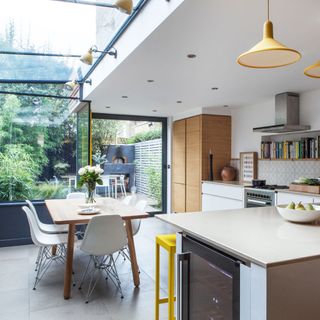 White kitchen diner with a glass conservatory extension