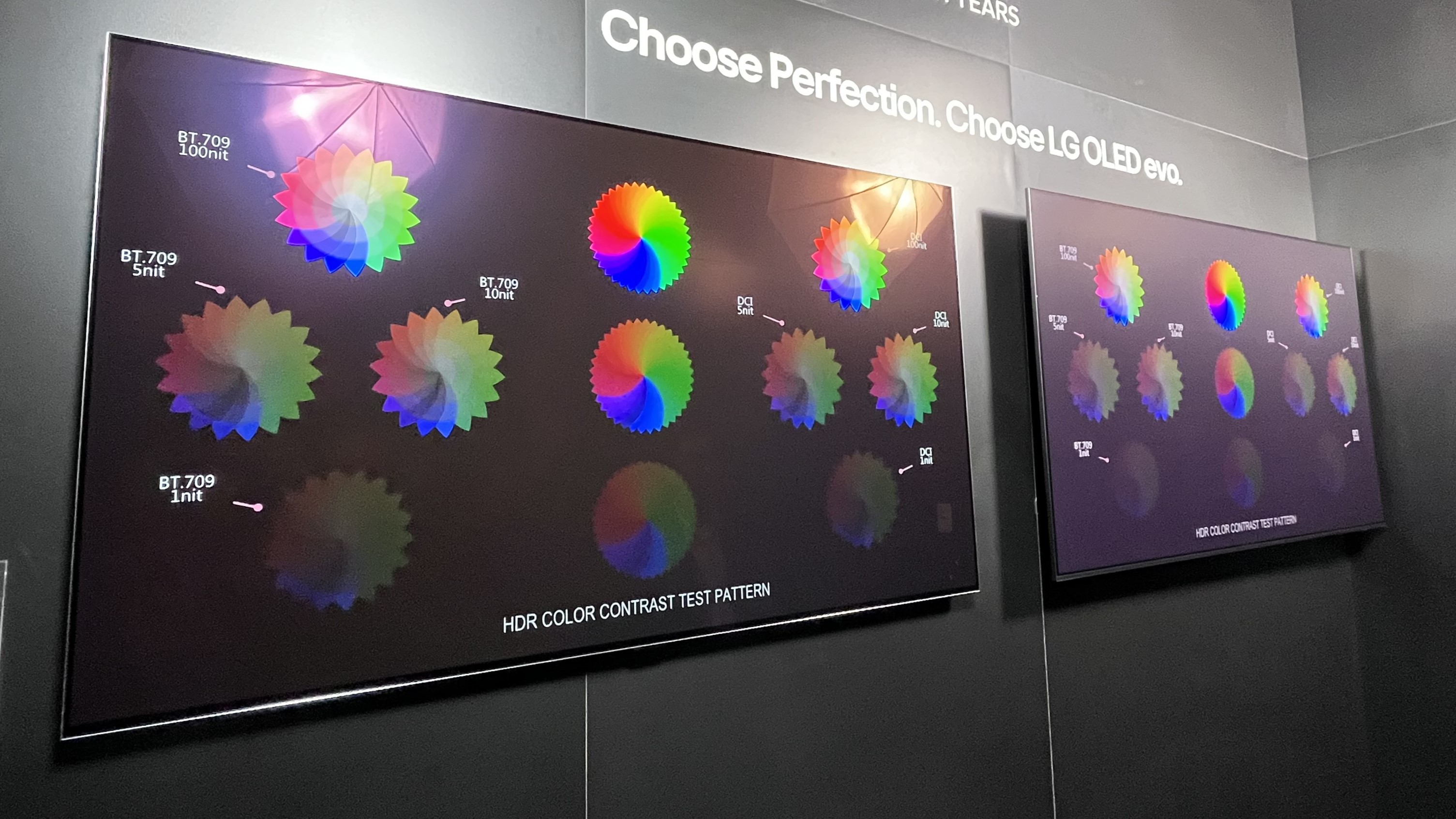 LG G4  and Samsung S95D OLED TVs side by side displaying test pattern