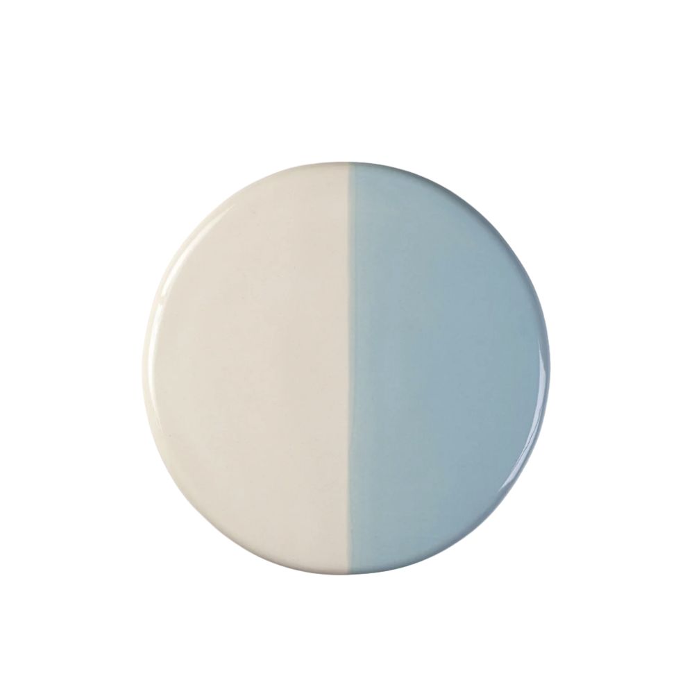 blue and white circular stoneware platter