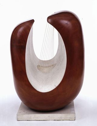 A wooden sculpture representing a harp.