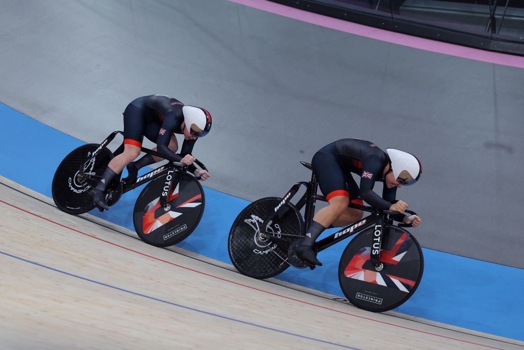 Britain's Emma Finucane (L) and Britain's Sophie Capewell compete in the women's track cycling team sprint final for gold of the Paris 2024 Olympic Games at the Saint-Quentin-en-Yvelines National Velodrome in Montigny-le-Bretonneux, south-west of Paris, on August 5, 2024. (Photo by Thomas SAMSON / AFP)