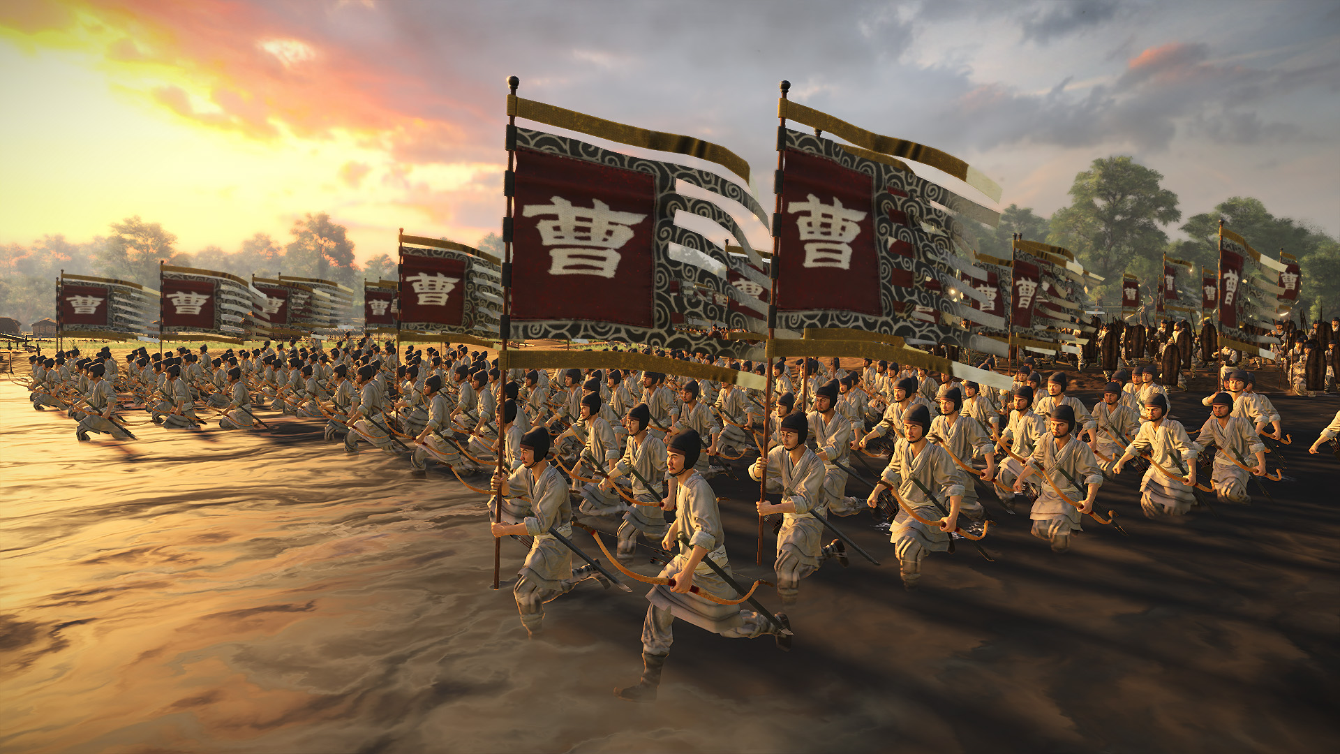 Best co-op games - Total War: Three Kingdoms - A large army of infantry run with weapons drawn and carrying flags.