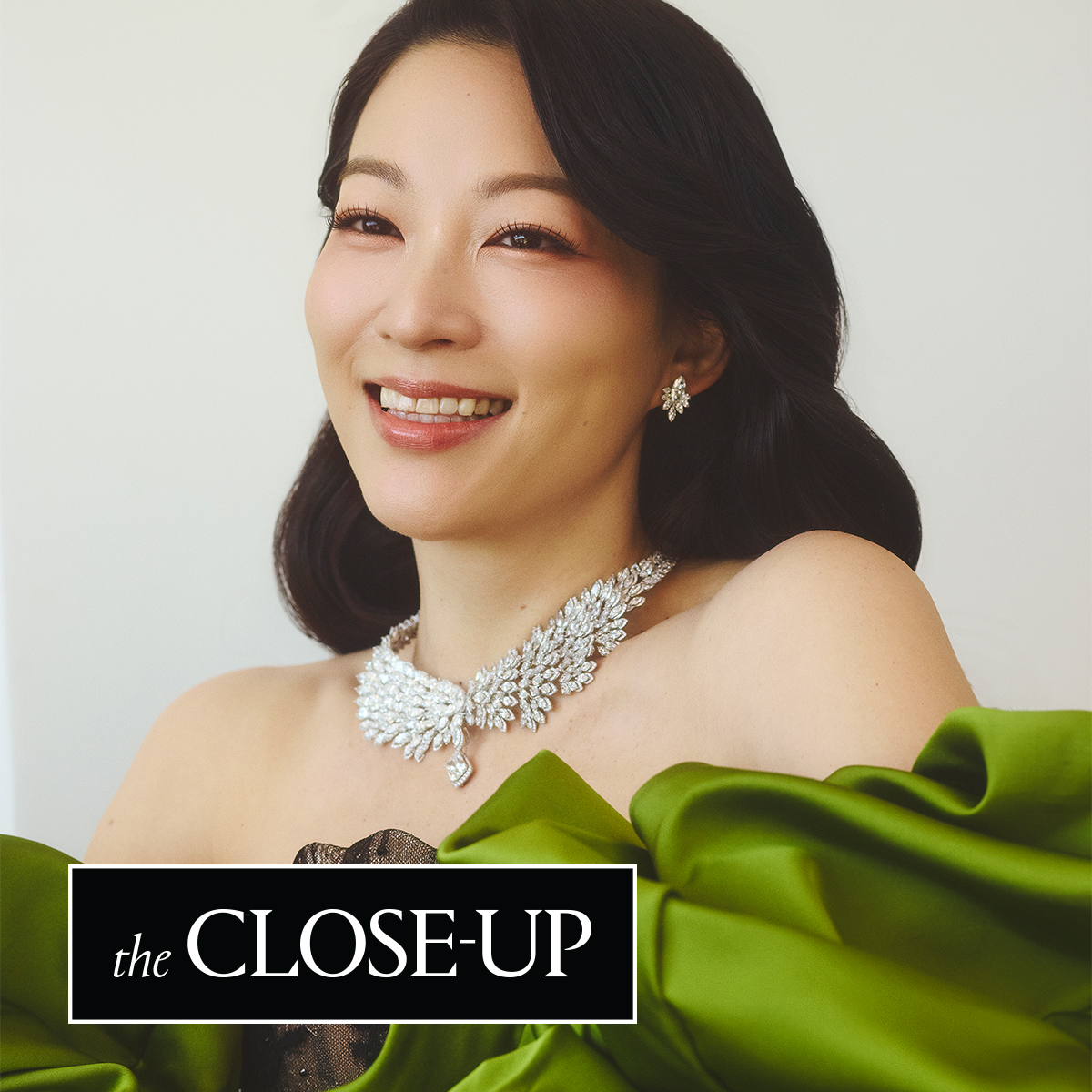 Arden Cho at the 2026 Oscars red carpet in a dress and statement sleeves from Korean designer Miss Sohee