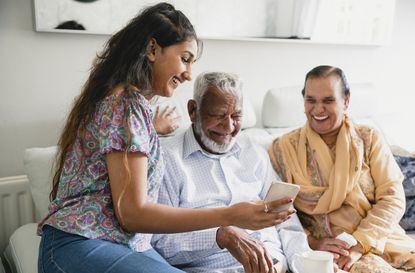 Asian woman talking grandparents about donating their organs