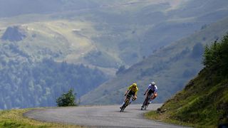 PEYRAGUDES, FRANCE - JULY 20: (L-R) Jonas Vingegaard Rasmussen of Denmark and Team Jumbo - Visma - Yellow Leader Jersey and Tadej Pogacar of Slovenia and UAE Team Emirates - White Best Young Rider Jersey compete in the breakaway descending the Col de Val Louron-Azet (1580m) during the 109th Tour de France 2022, Stage 17 a 129,7km stage from Saint-Gaudens to Peyragudes 1580m / #TDF2022 / #WorldTour / on July 20, 2022 in Peyragudes, France. (Photo by Tim de Waele/Getty Images)