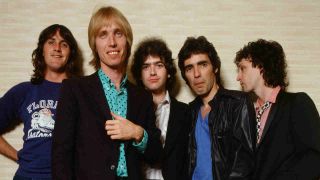 Tom Petty & The Heartbreakers posing for a photograph in 1980