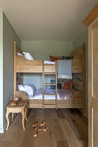 bedroom with bunk bed and wooden floor