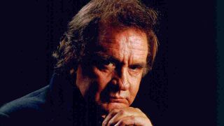 Johnny Cash posing for a photograph in 1994