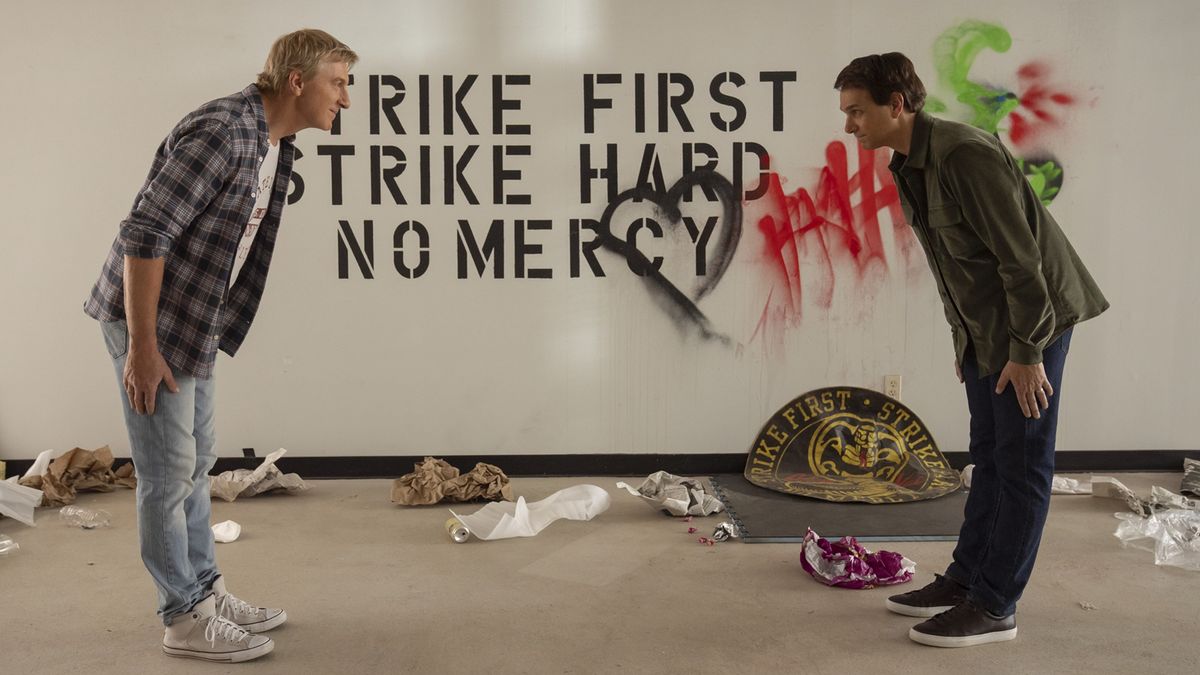 William Zabka as Johnny Lawrence, Ralph Macchio as Daniel LaRusso in Cobra Kai