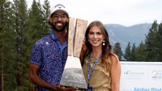 Akshay Bhatia and girlfriend Presleigh Schultz pose after the former's win at the Barracuda Championship on the PGA Tour