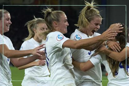 Who are The Lionesses as illustrated by a picture of some team members celebrating
