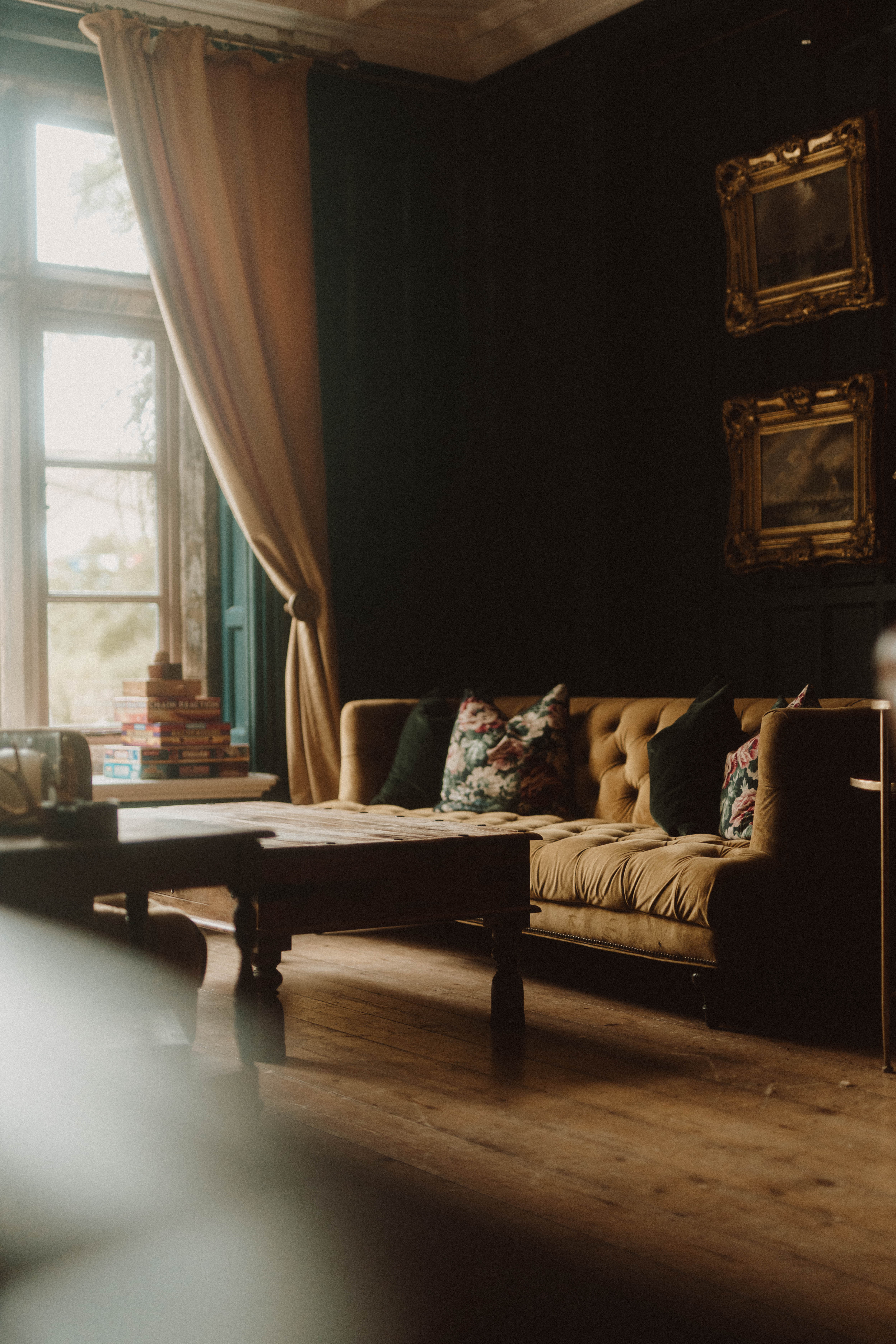 A series of interior and exterior shots depicting the rustic-style design and raw, dramatic grounds of an historical, brick-clad country house hotel.