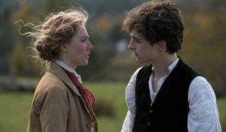 Little Women Saoirse Ronan and Timothee Chalamet stare intensely at each other in a field