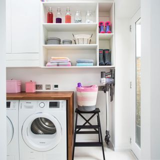 corner of utility room with open shelving and appliances next to each other