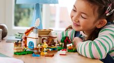 Lego Animal Crossing being built by a young girl