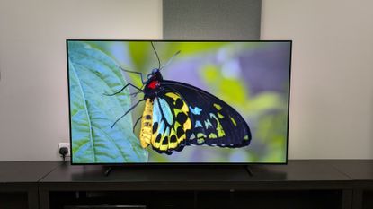 Philips OLED760 listing image showing a green butterfly on screen 