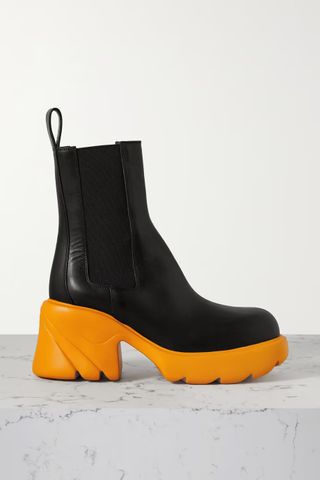 black platform boots with orange soles