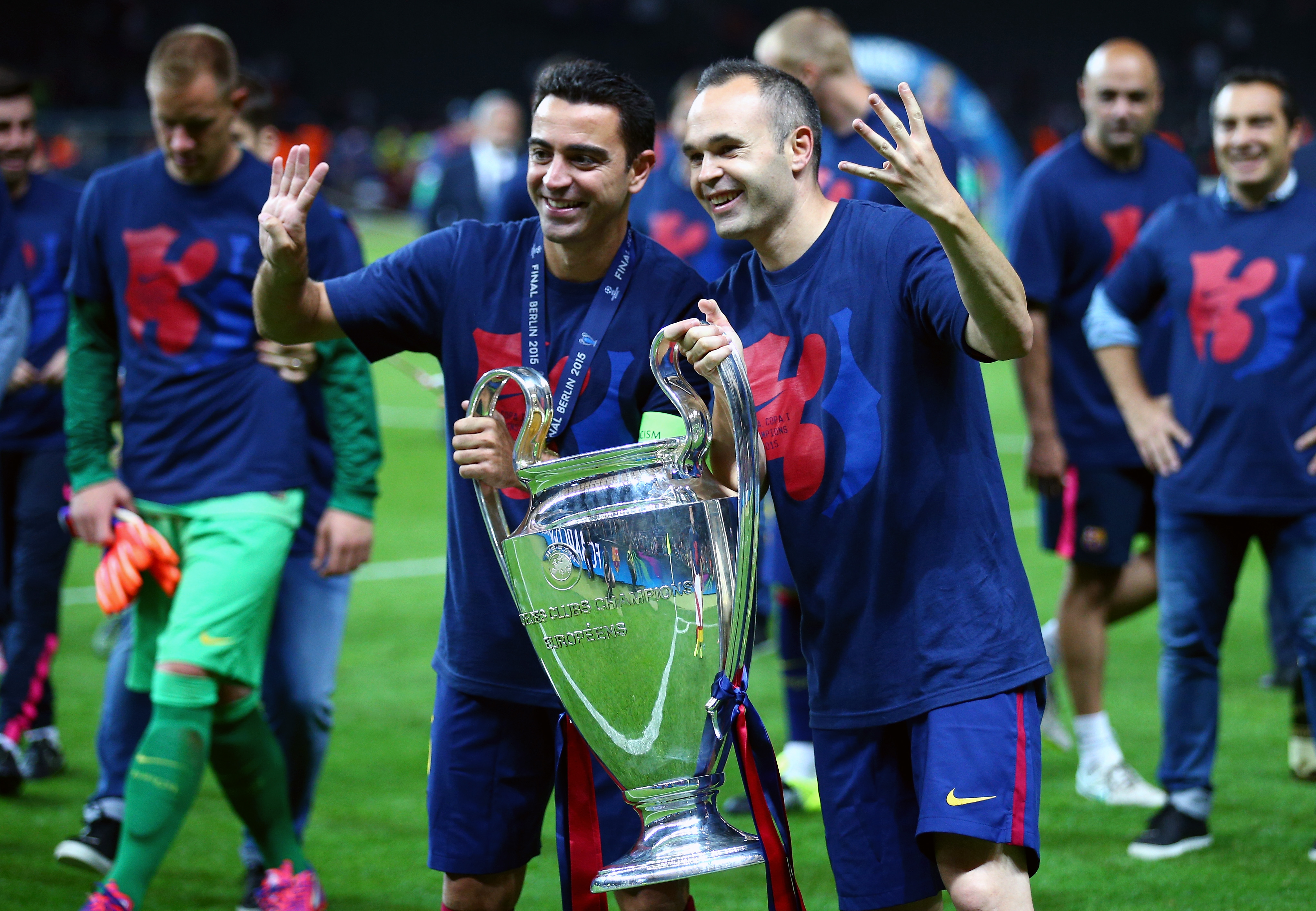 Barcelona pair Xavi and Andres Iniesta celebrate with the Champions League trophy after victory over Juventus in the 2015 final.