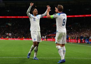 Harry Kane of England celebrates after scoring the team's third goal with Jude Bellingham during the UEFA EURO 2024 European qualifier match between England and Italy at Wembley Stadium on October 17, 2023 in London, England. (Photo by Richard Heathcote/Getty Images)