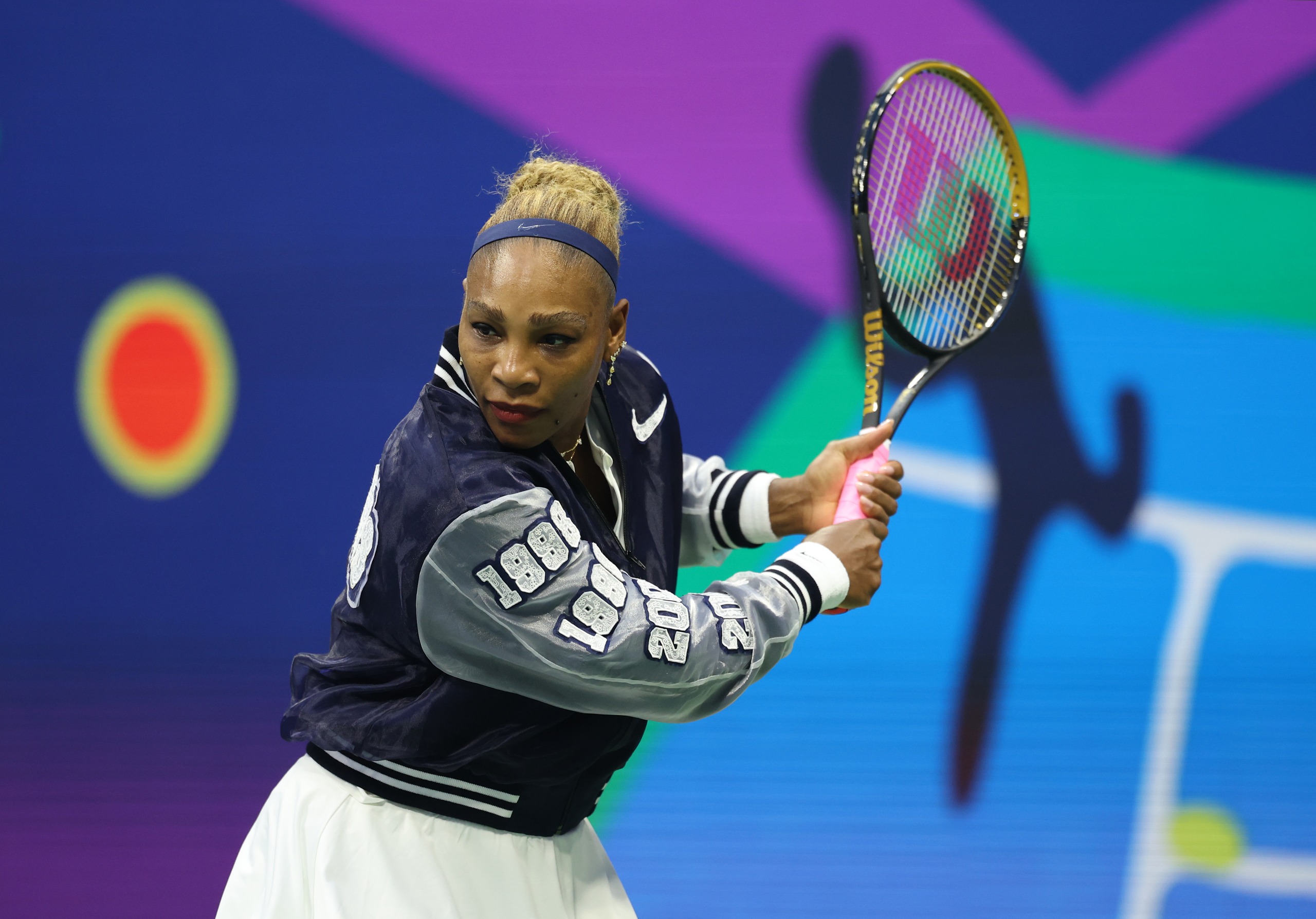 Serena Williams wears a custom Nike jacket to play doubles with sister Venus Williams