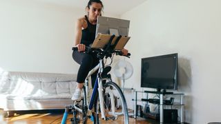 Woman rides connected turbo trainer