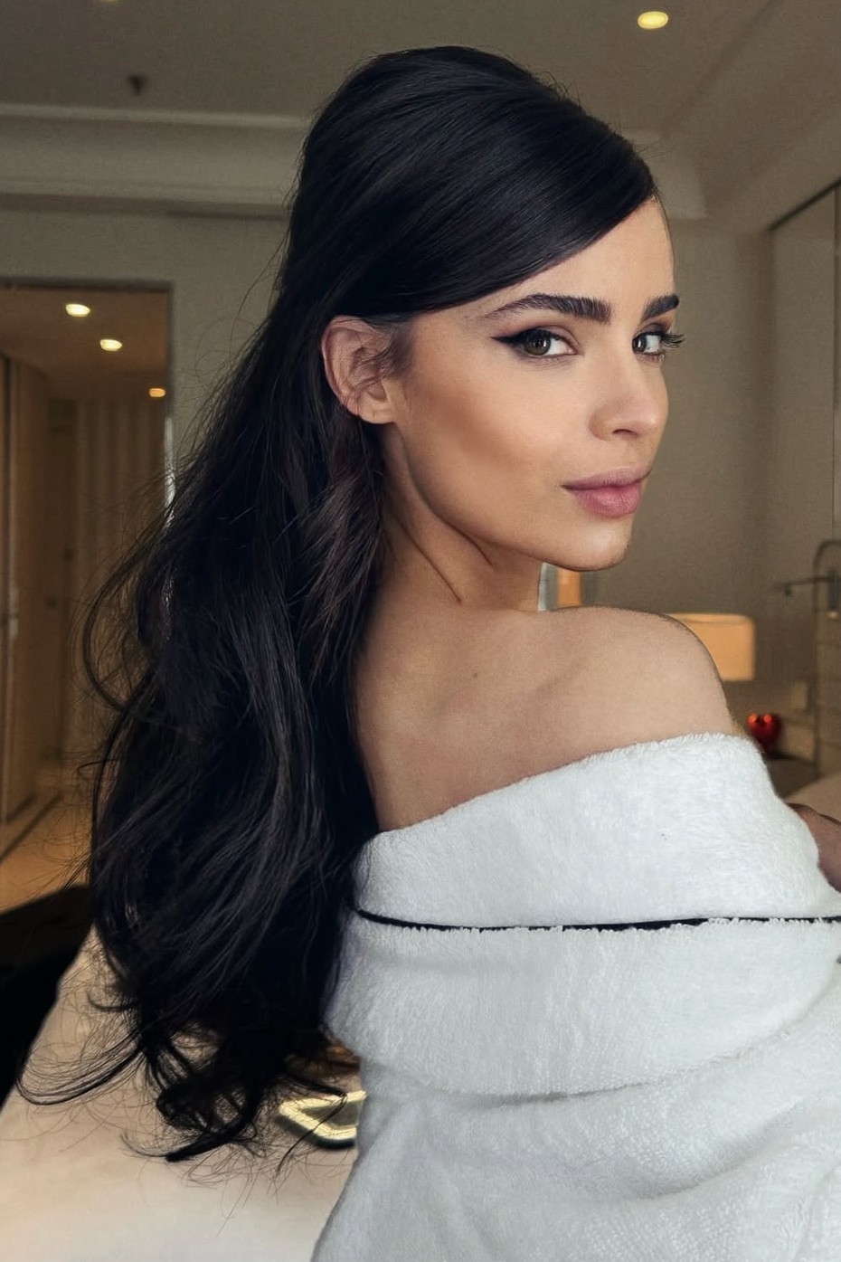 A model showing off a teased wedding hairstyle.
