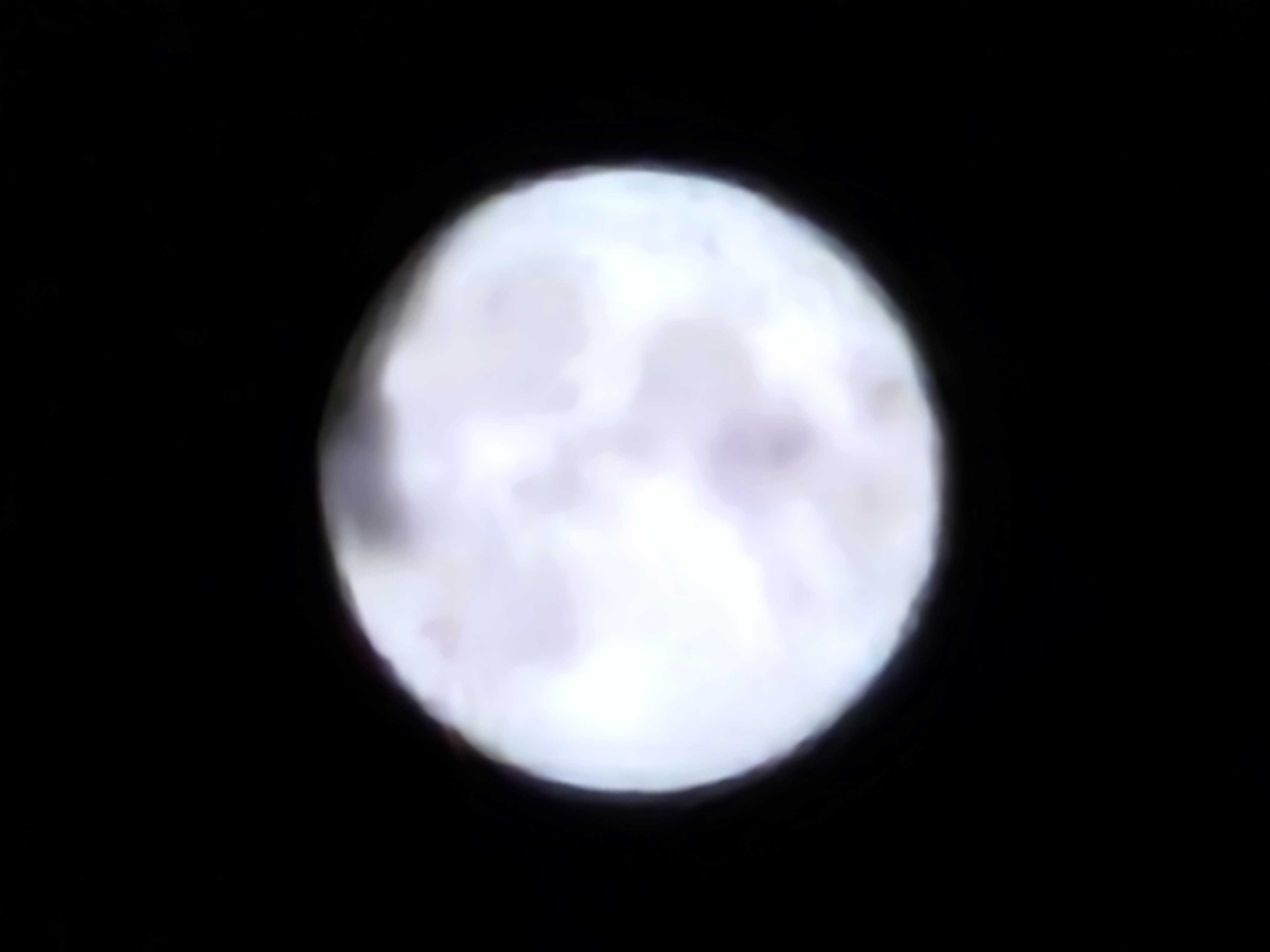 A photo of an artificially blurred image of a moon taken on the Galaxy S23 Ultra at 100x magnification, designed to prove whether or not Samsung's photo processing is "faking" the image