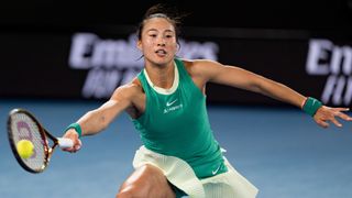 Qinwen Zheng reaches for a forehand at the Australian Open 2024