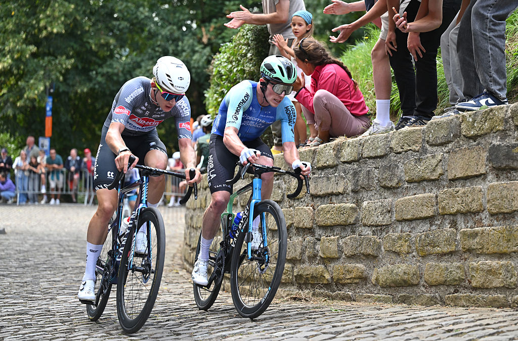 GERAARDSBERGEN, BELGIUM - AUGUST 22: (L-R) Tibor Del Grosso of Netherlands and Team Alpedin - Deceuninck and Stan Dewulf of Belgium and Decathlon AG2R La Mondiale Team compete passing through Wall of Geraardsbergen during the 20th Renewi Tour 2025, Stage 3 a 181.8km stage from Aalter to Geraardsbergen / #UCIWT / on August 22, 2025 in Geraardsbergen, Belgium. (Photo by Luc Claessen/Getty Images)