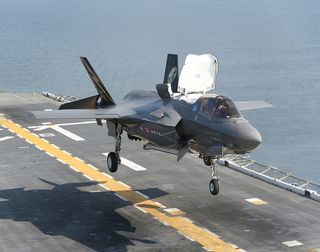 f-35b vertical night landing at sea