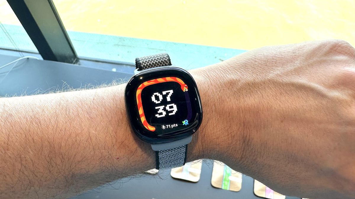 Fitbit Ace LTE on a person&#039;s wrist