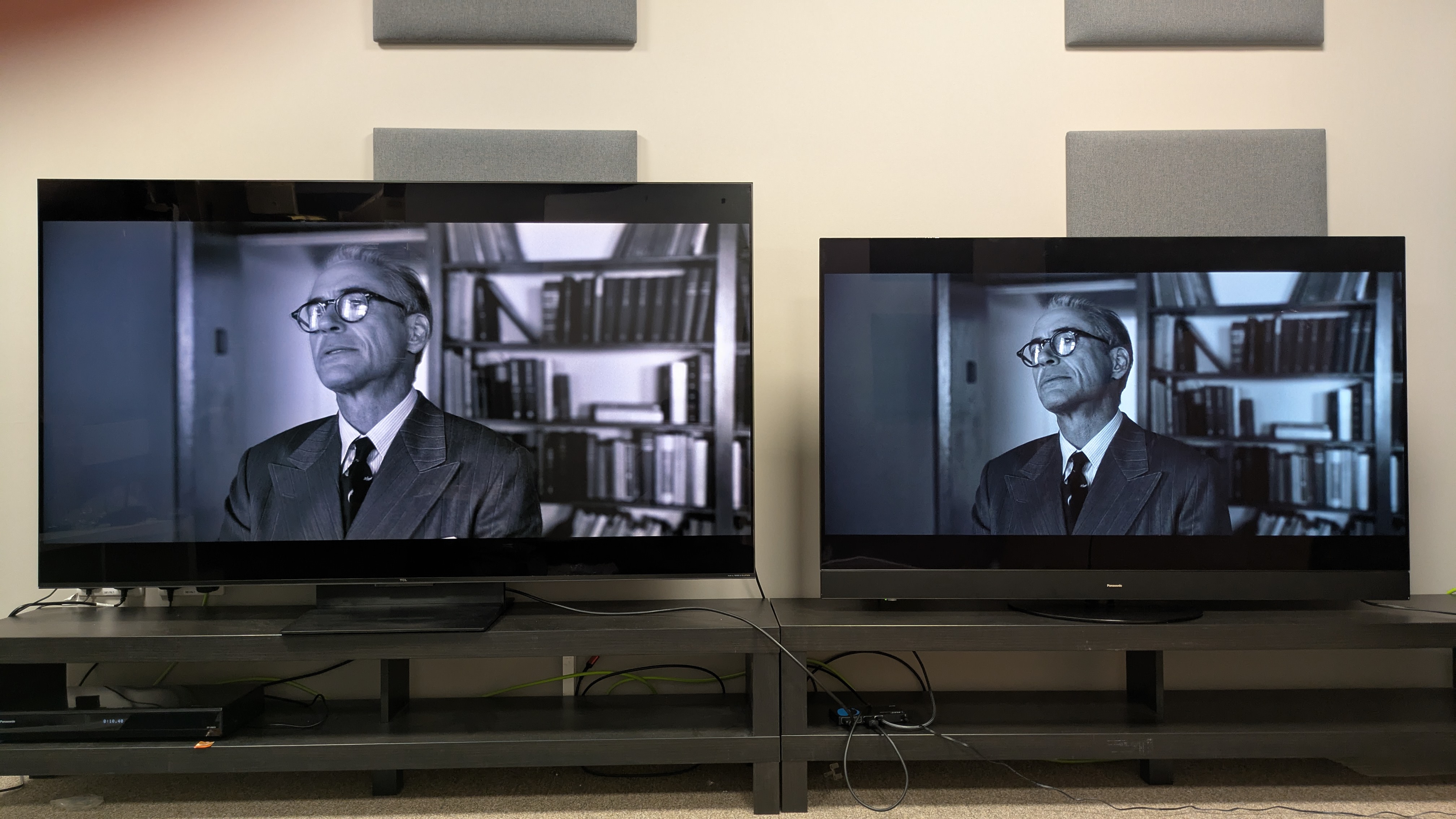 TCL C7K mini-LED left and Panasonic MZ1500 OLED right displaying Admiral Strauss from Oppenheimer on screen