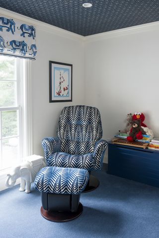 Blue boys bedroom with reading chair