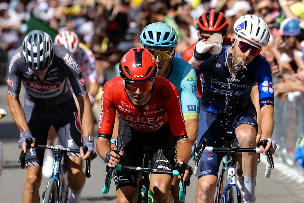 Arkea - B&amp;B Hotels team's Colombian rider Cristian Rodriguez (C), Astana Qazaqstan Team's Colombian rider Harold Tejada (rear) and Groupama - FDJ team's French rider Quentin Pacher (R) cycle in a breakaway up the San Luca ascent near Bologna during the 2nd stage of the 111th edition of the Tour de France cycling race, 199 km between Cesenatico and Bologna, in Italy, on June 30, 2024. (Photo by Thomas SAMSON / AFP)