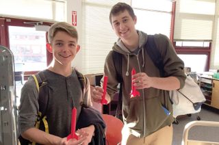 Students at Yorktown High School show off their rocket noses, designed and printed as part of an AP Physics lab.