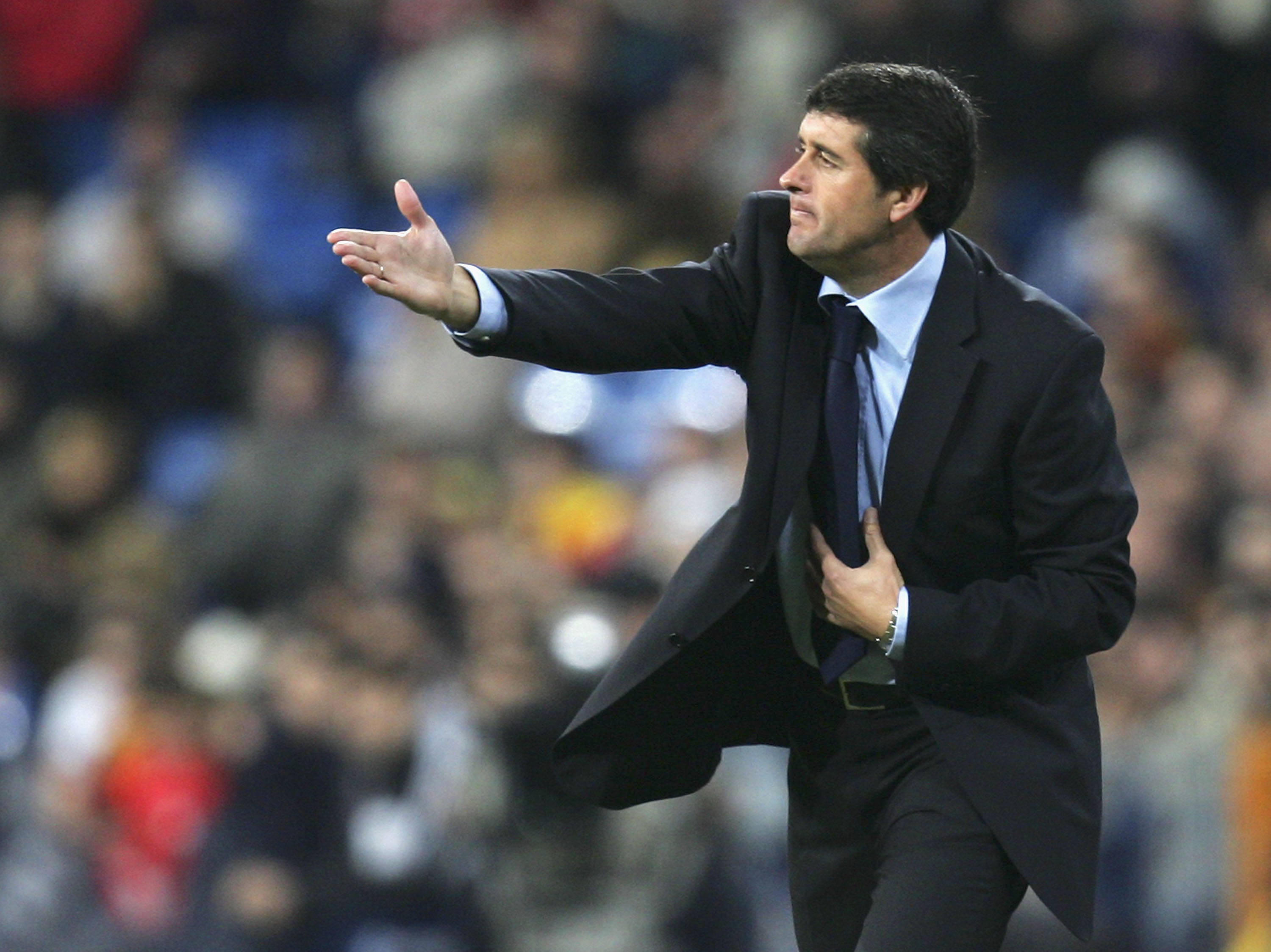 Real Madrid coach Juan Ramon Lopez Caro gives instructions during a game against Osasuna in December 2005.
