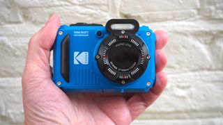 Blue Kodak PIXRO WPZ2 waterproof digital camera being held in the tester's hand