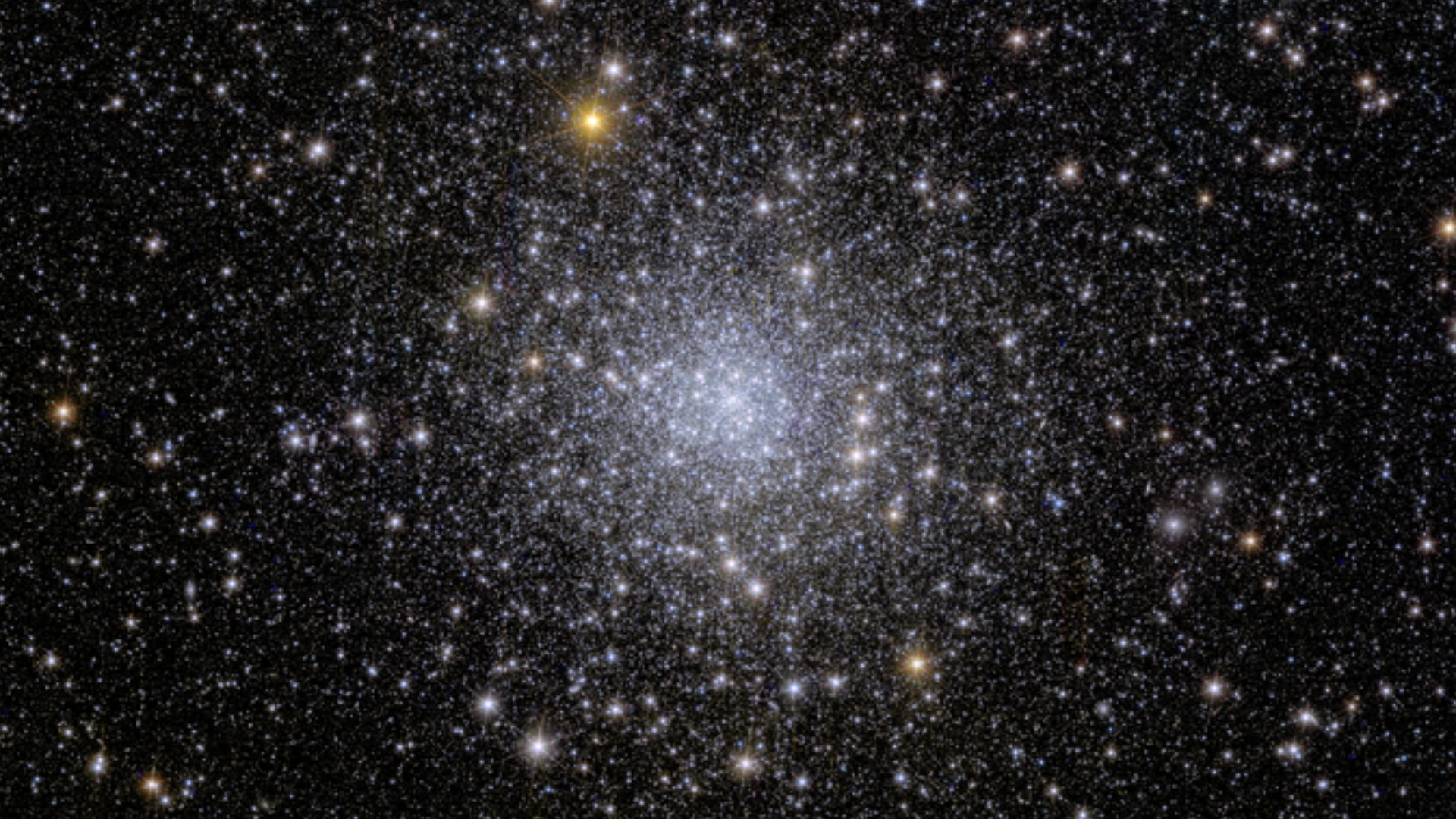 A glittering bundle of stars against the darkness of space.