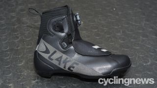 Lake CX146 winter cycling shoes against a floor mat